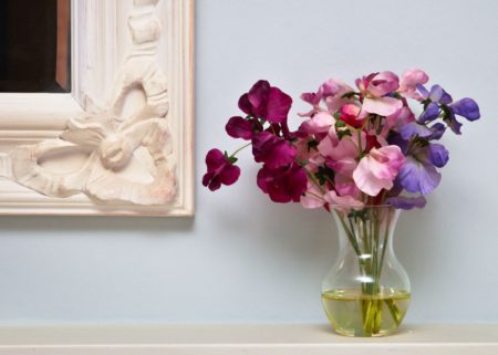 Flowers On A Mantle Piece In A Vintage Home