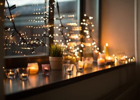 Lots of candles on windowsill 