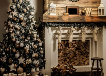 room with Christmas tree, fireplace. Interior eco style. Christmas decorated interior of couch and Christmas tree, modern and cozy. happy new year and merry christmas
